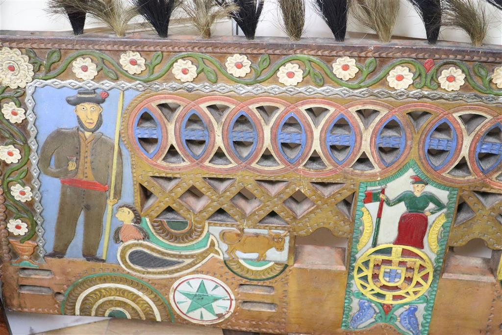 An Eastern European folk art carved and painted wood dog cart wedding gift, 72cm x 108cm